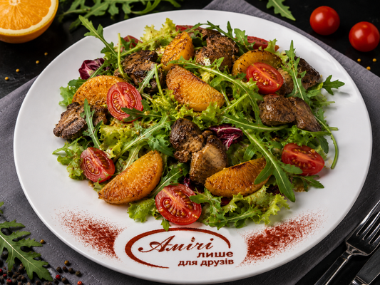 Warm salad with chicken liver and orange