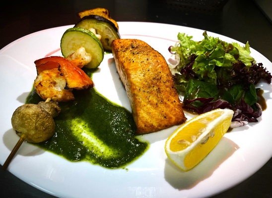 Grilled fish with mixed vegetables, salad and signature sauce