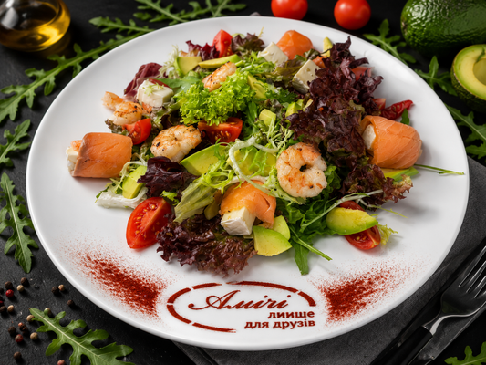 Salad with lightly salted salmon, Brie cheese and tiger shrimp