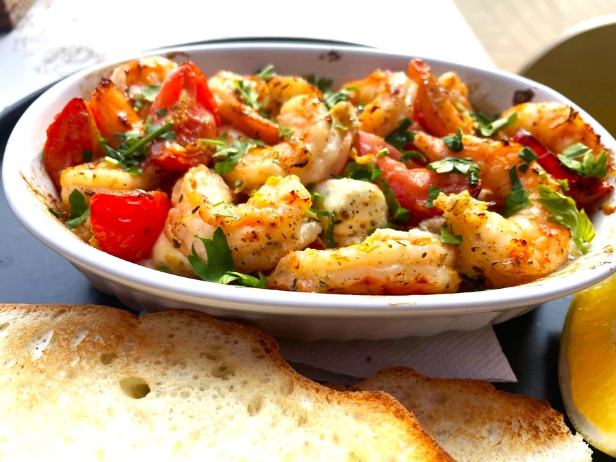 Tiger prawns with feta cheese and cherry tomatoes